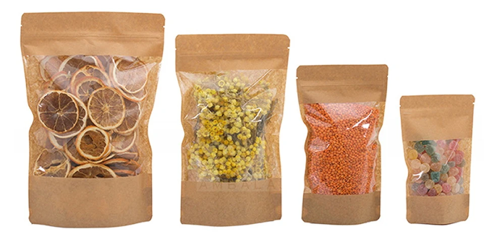 Farklı boyutlardaki büyük pencereli kraft doypack poşetlerde limon dilimi, çiçek, mercimek ve renkli şekerlemeler
